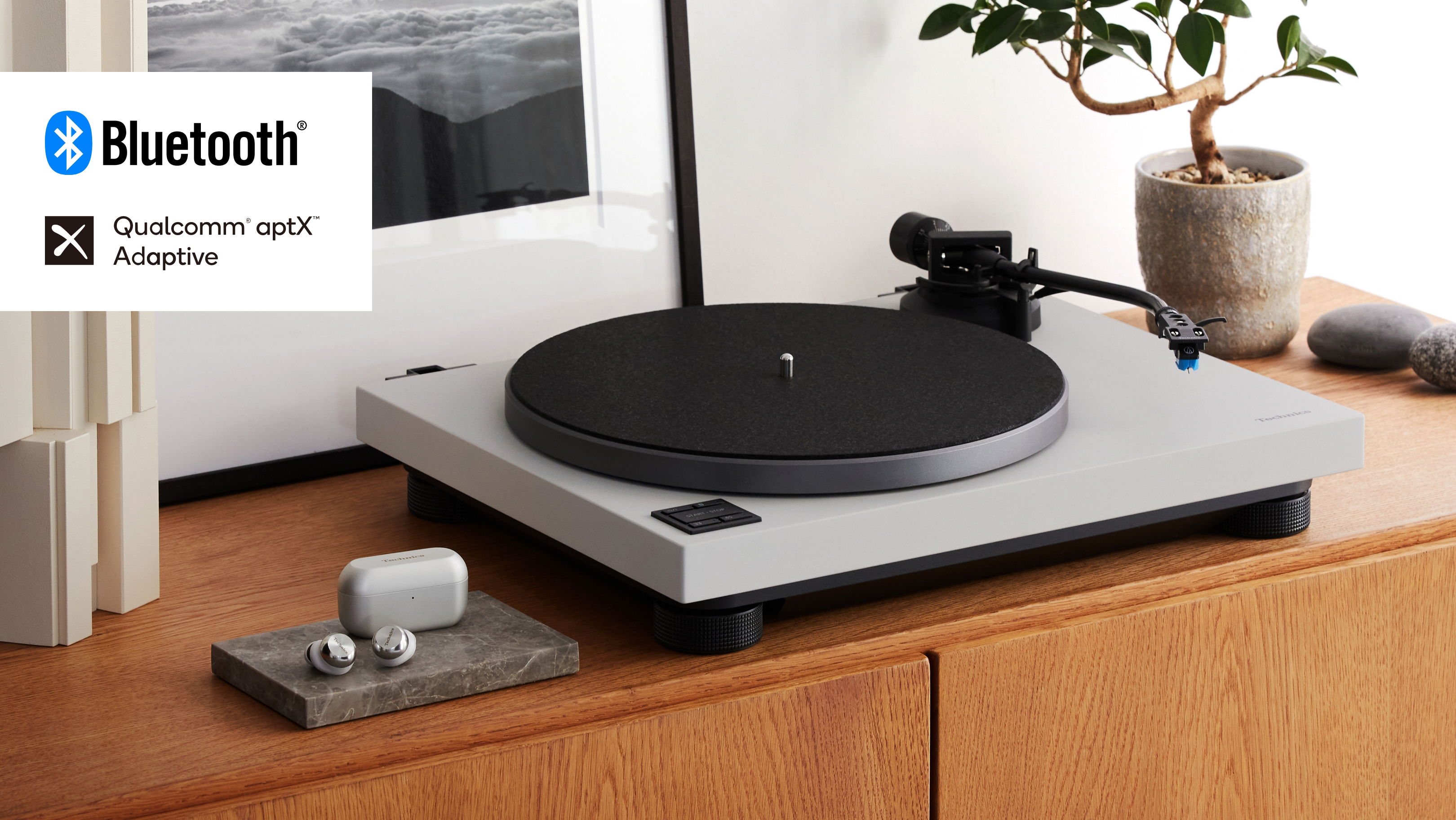 Kuva suoravetoisesta levysoitinjärjestelmästä SL-40CBT, harmaa Bluetooth-logolla