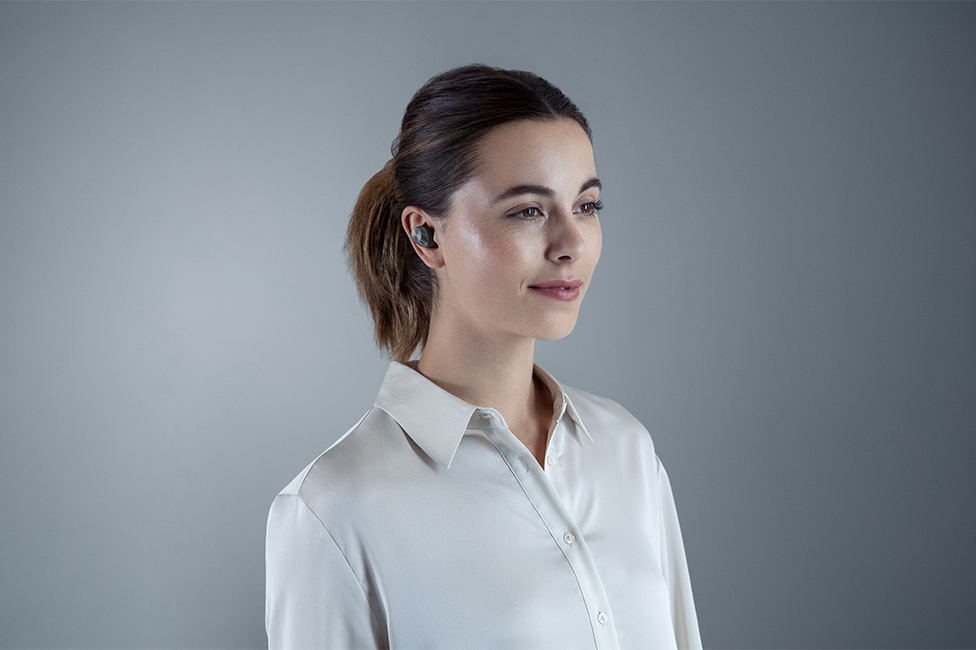 Woman wearing earbuds