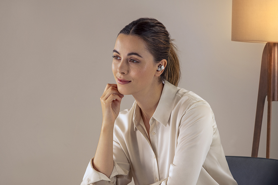 Woman wearing earbuds