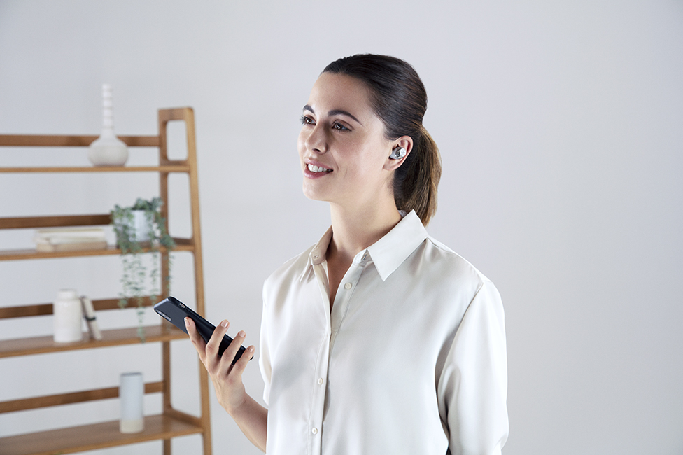 Woman wearing earbuds