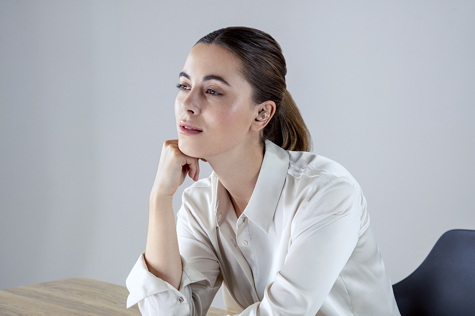 Woman wearing earbuds